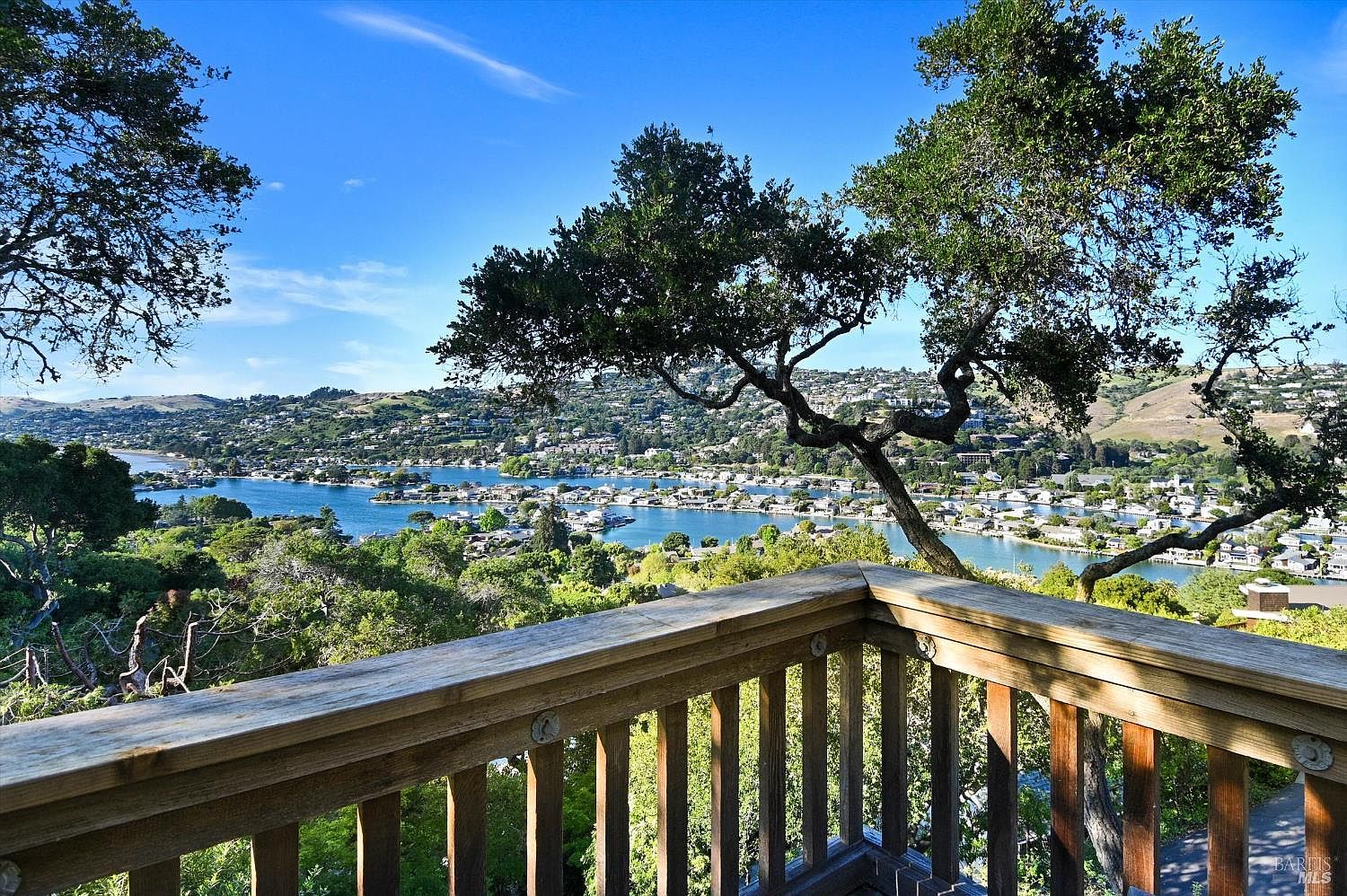 Compact deck terrace overlooking Belvedere harbor with the Tiburon yacht club below